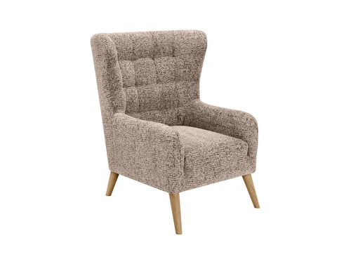 Casey Es Quilted Armchair with high backrest and hardwood legs in modern interior setting